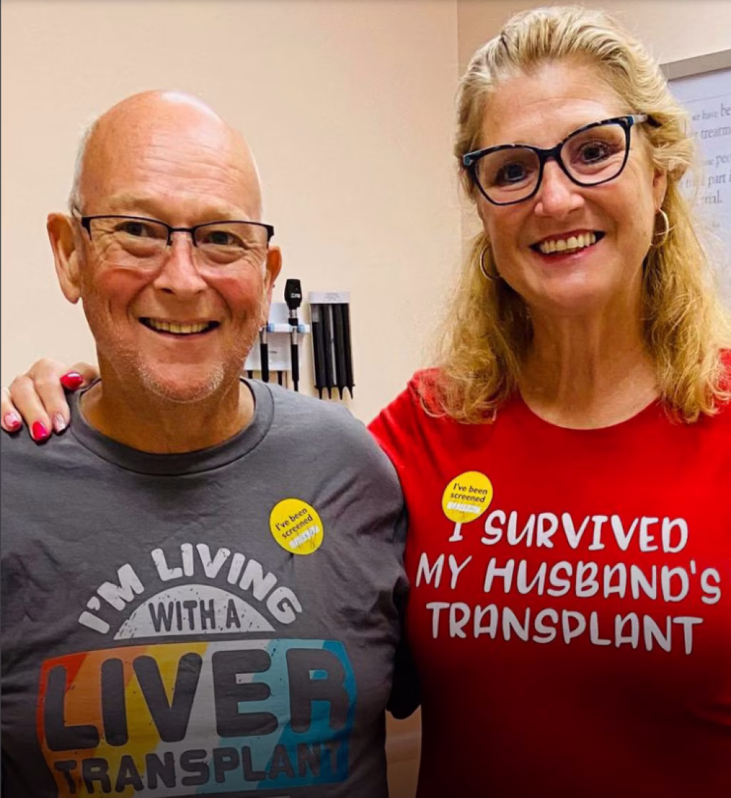 husband, a liver transplant recipient, stand with his wife